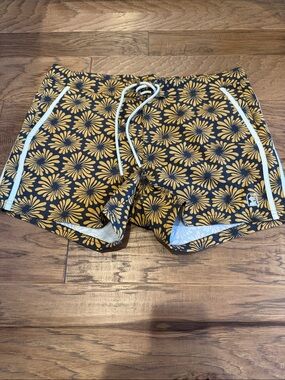 Men's "Dandy Del Mar" Floral Swim Shorts in Black and gold